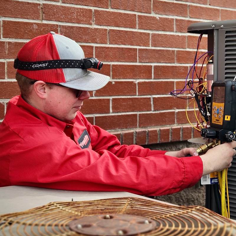 A friendly Franklin HVAC tech on the job in Northwest Arkansas.